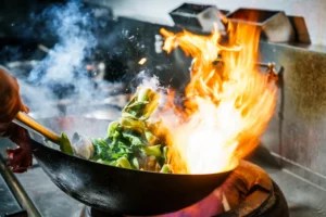 How To Put Out a Grease Fire Quickly and Safely, According to a Professional Chef