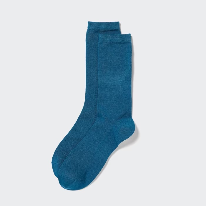A pair of teal blue uniqlo heattech warm socks