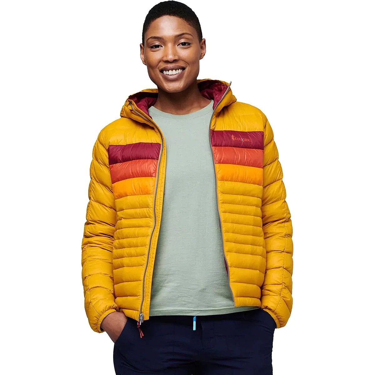 model wearing a yellow, red and orange striped cotopaxi down jacket now on sale at backcountry