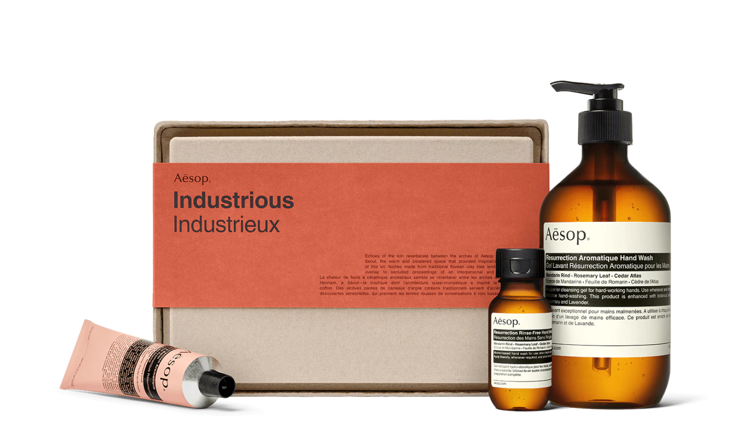 aesop industrious kit including the hand wash, hand sanitizer, and hand balm in front of the gift box