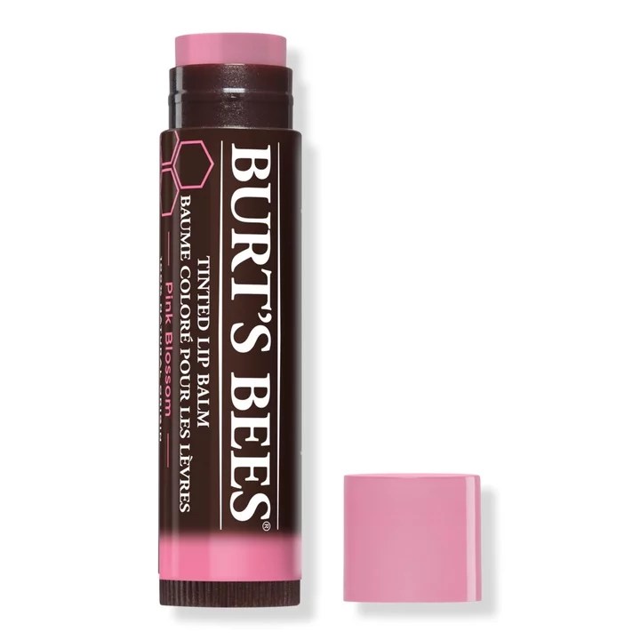 A brown tube of Burt's Bees pink tinted lip balm.