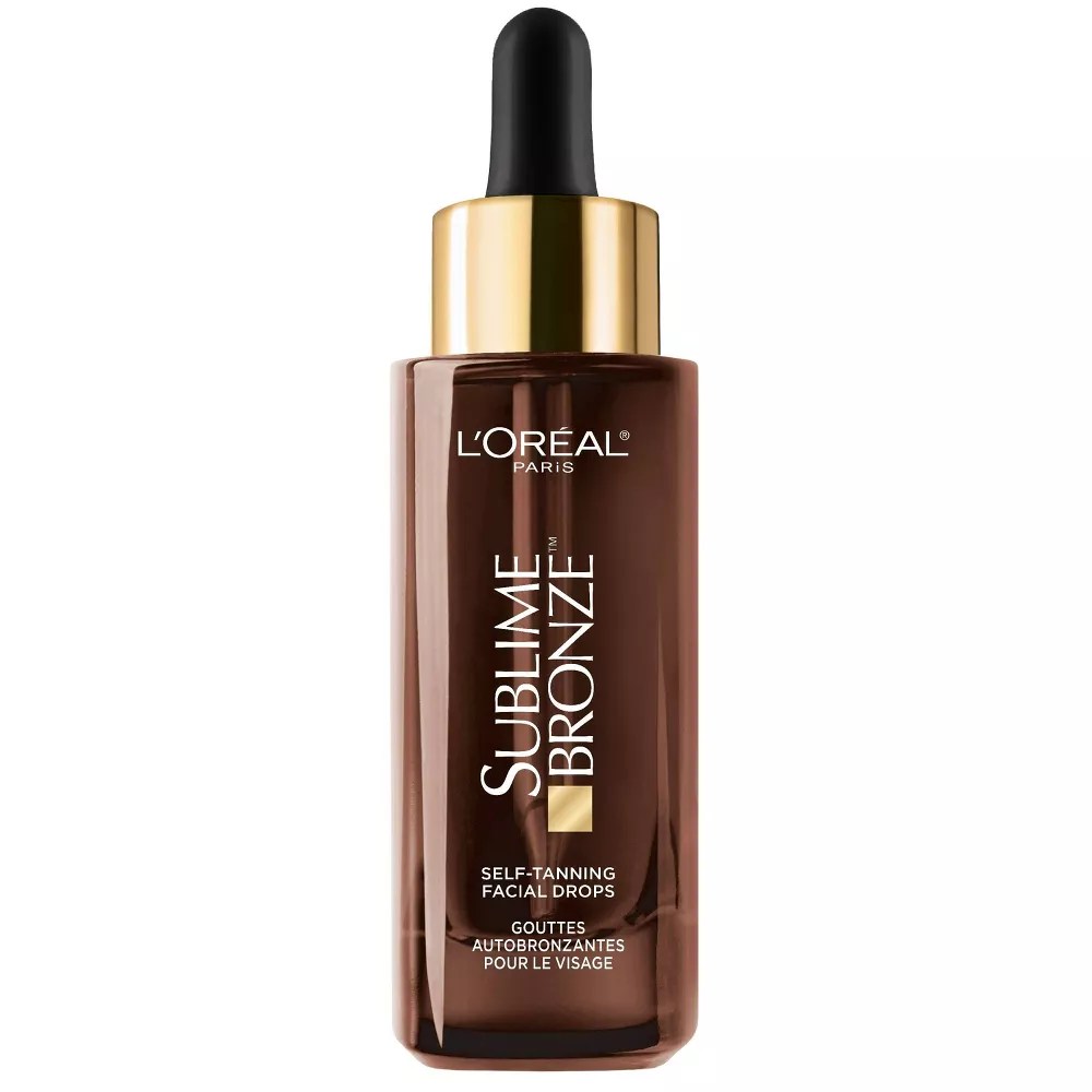 l'oreal paris sublime tanning drops bottle with a gold cap, on a white background
