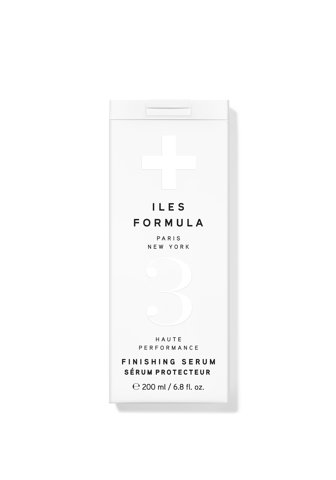 A white bottle of Iles Formula hair serum.
