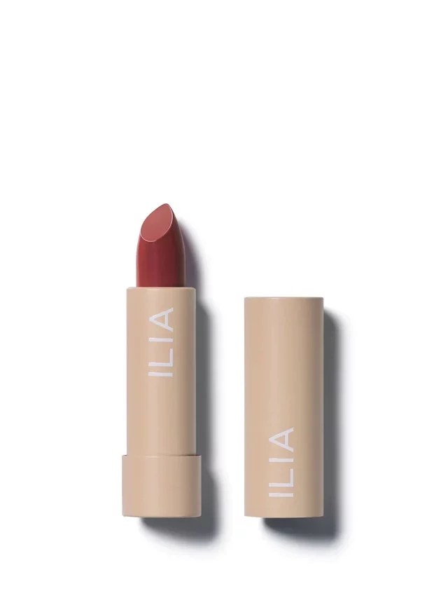 A brown tube of Ilia lipstick.