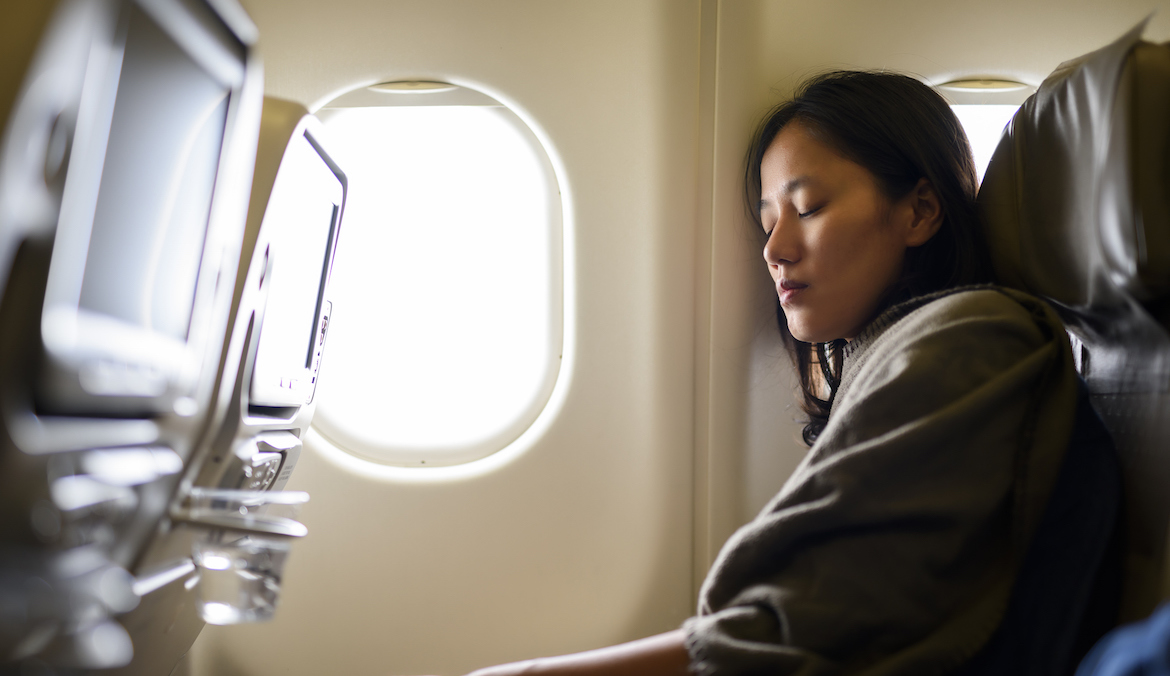 Woman sleeping on airplane