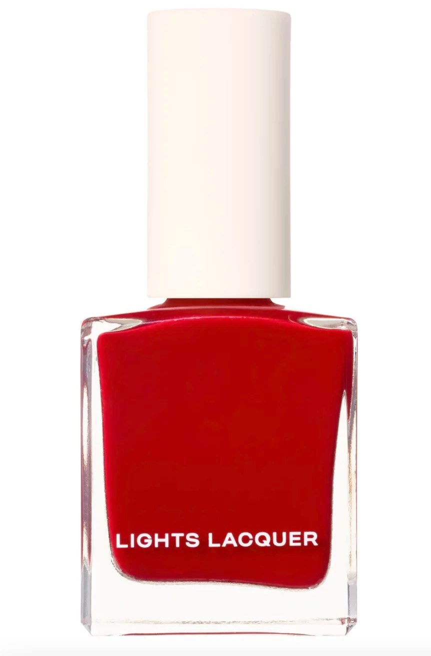 A bottle of red nail polish.