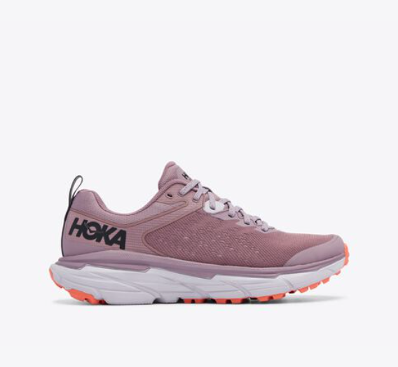 A pair of mauve Hoka running shoes.