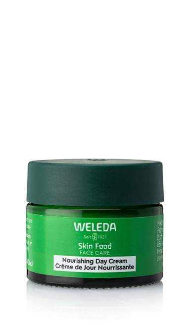 A green jar of Weleda day cream.