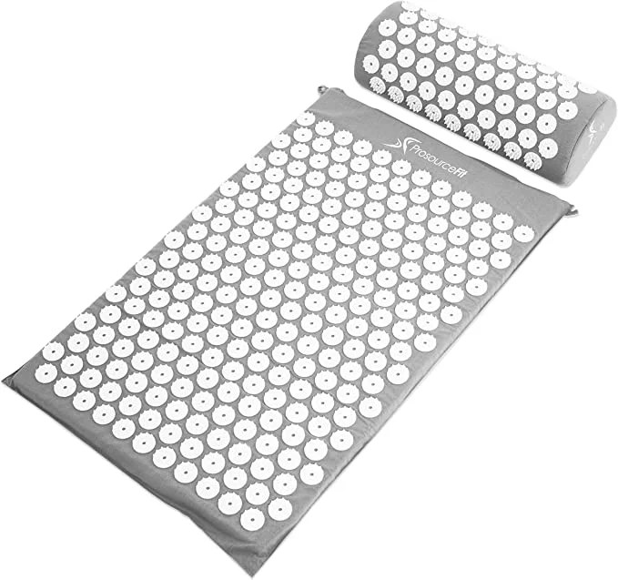 acupressure mat and pillow set on a white background