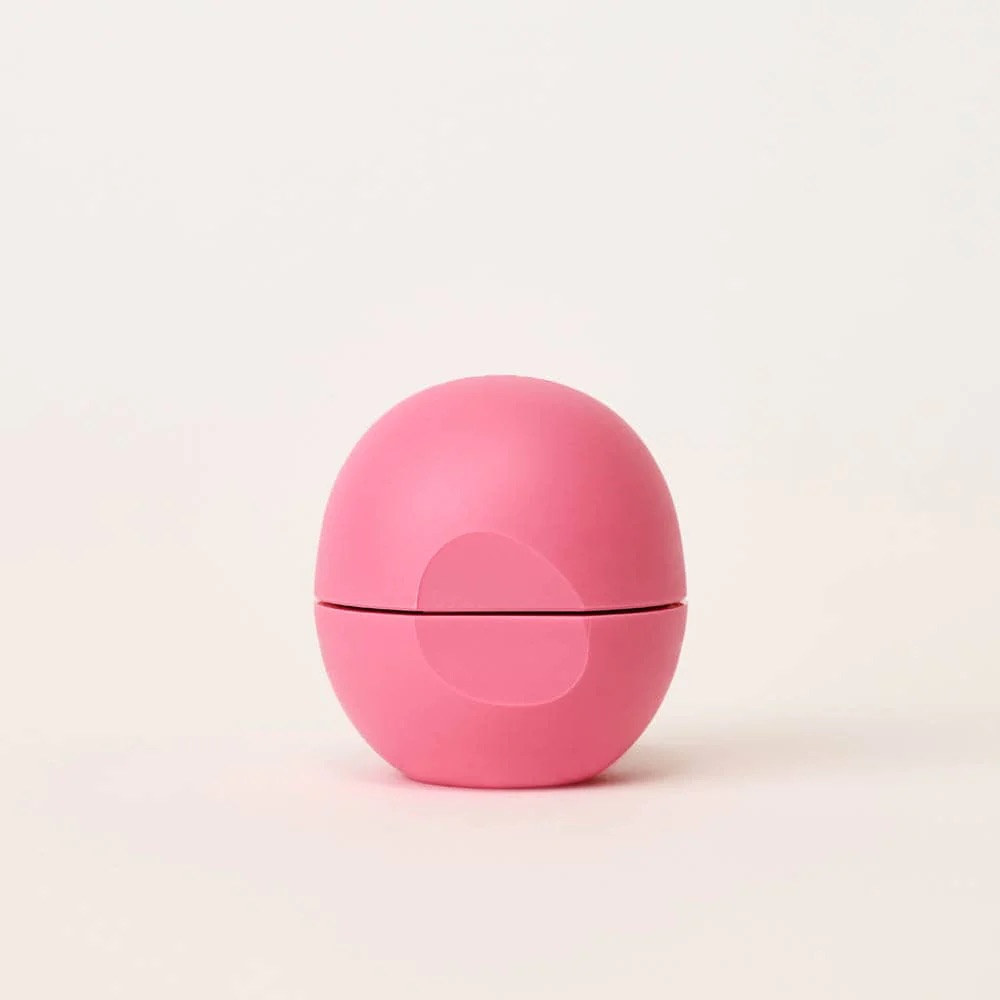 A pink eos lip balm.