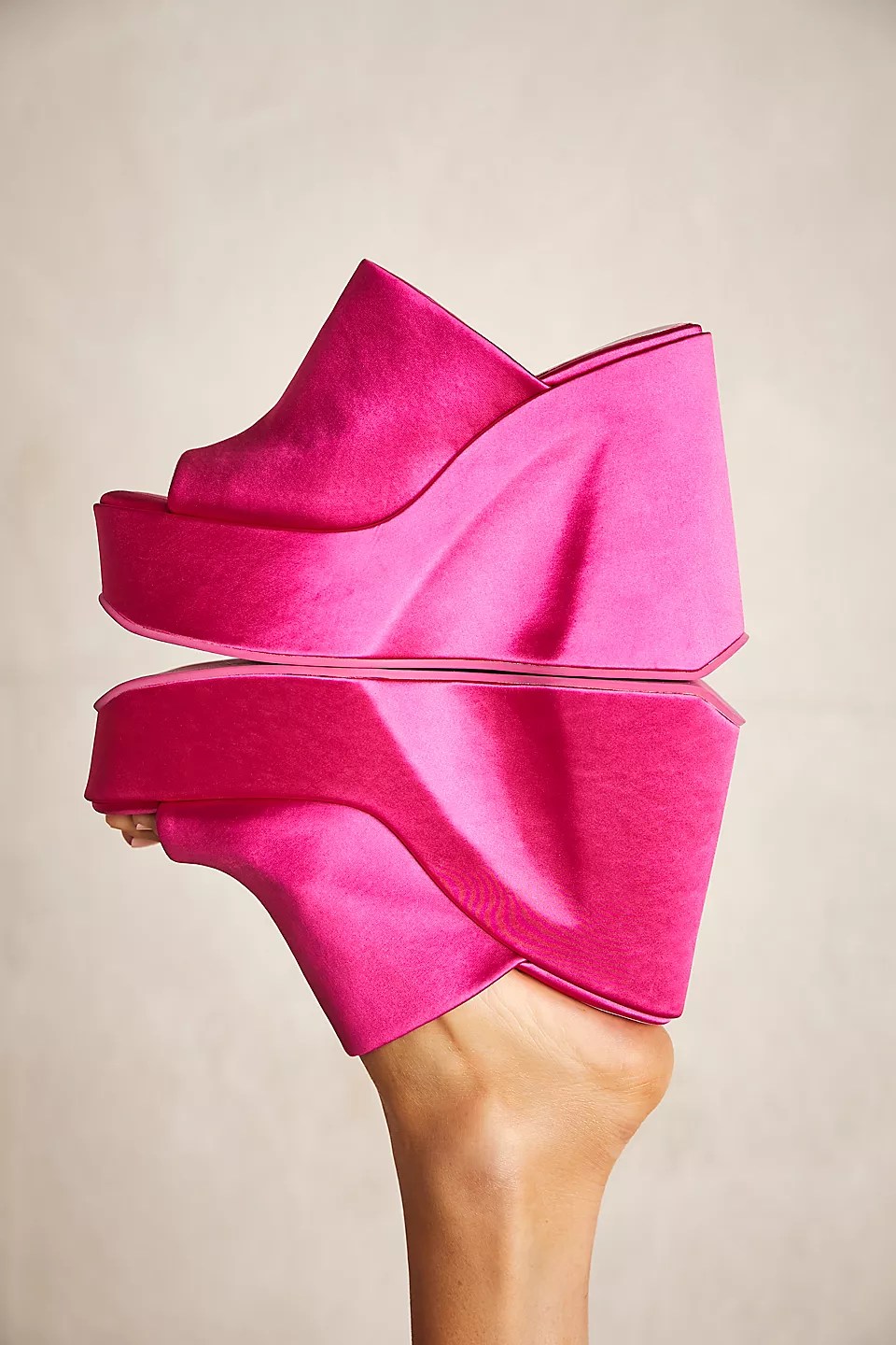 jeffrey campbell fuchsia satin wedge heels for holiday parties on dark brown background