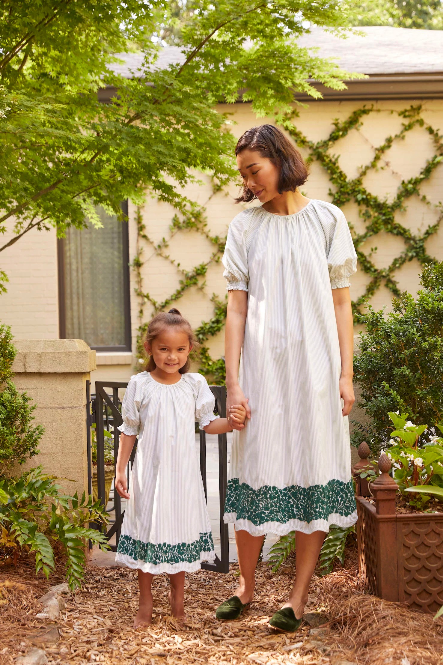 woman and child wearing the lake and mi golondrina collab nightgowns outside