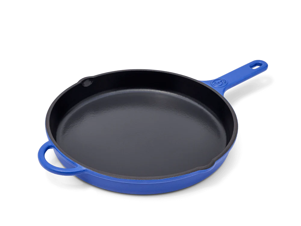 king sear cast iron in blue in front of a white background
