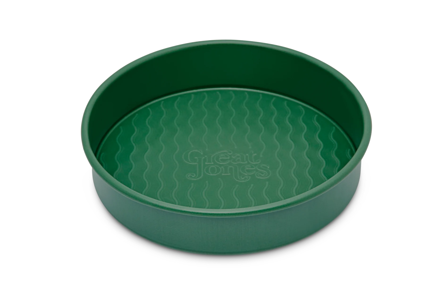 great jones patty cake cake pan in green on a white background