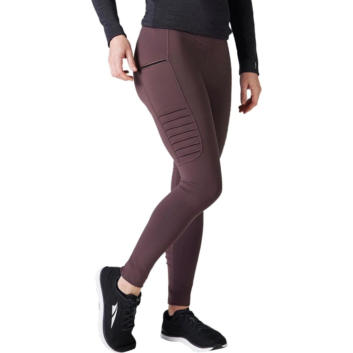 model wearing smartwool merino moto leggings that are on sale at backcountry