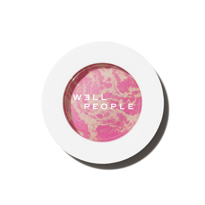 well people superpowder blush in guava twist on a white background for the i'm cold makeup look