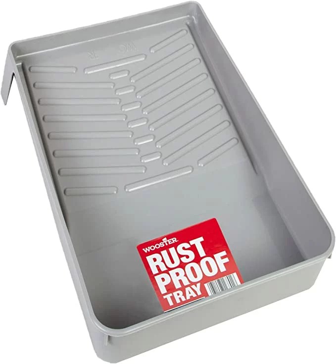 A gray plastic paint tray with a grooved surface from Wooster Brush