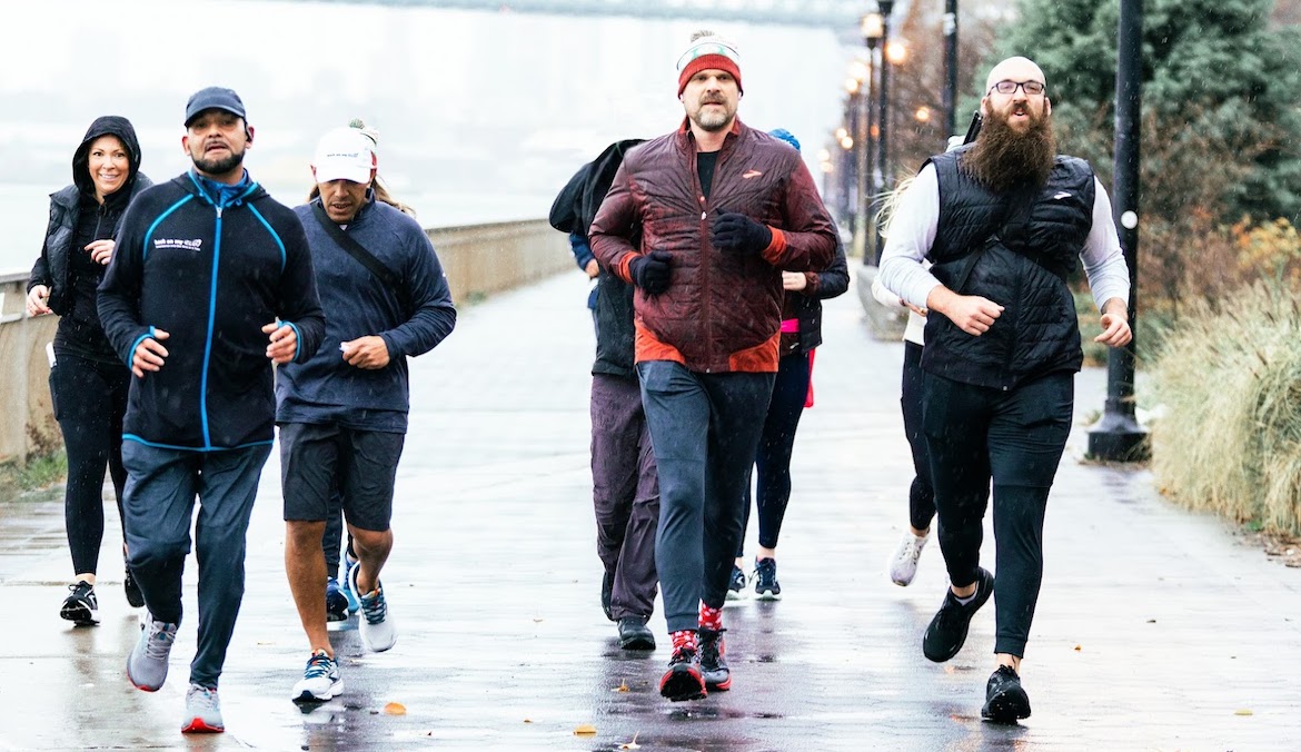 A group running together, including actor David Harbour.