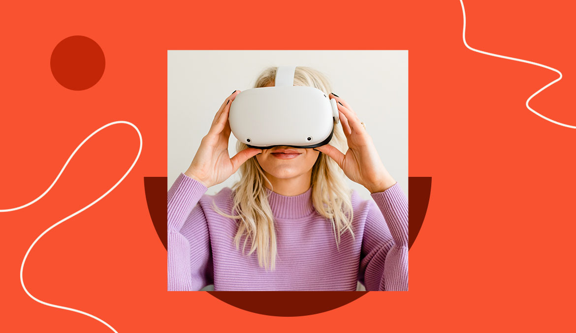 woman holds virtual reality headset