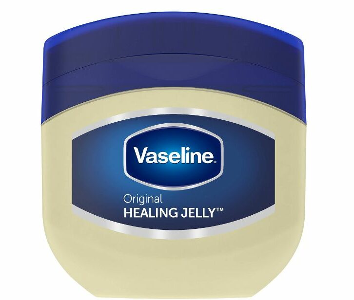 A tub of Vaseline with a navy blue lid.