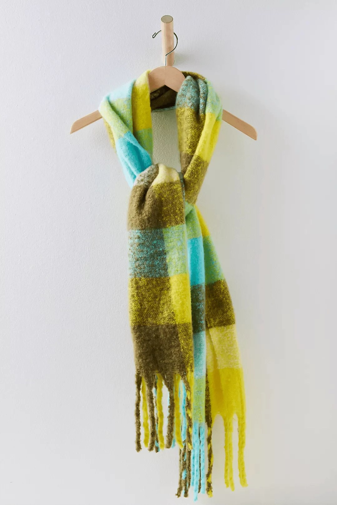 free people scarf that's a swap for the acne studios scarf on a light gray background
