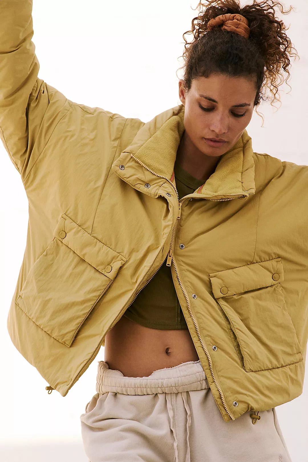 free people phoebe packable puffer on a model in front of a white background