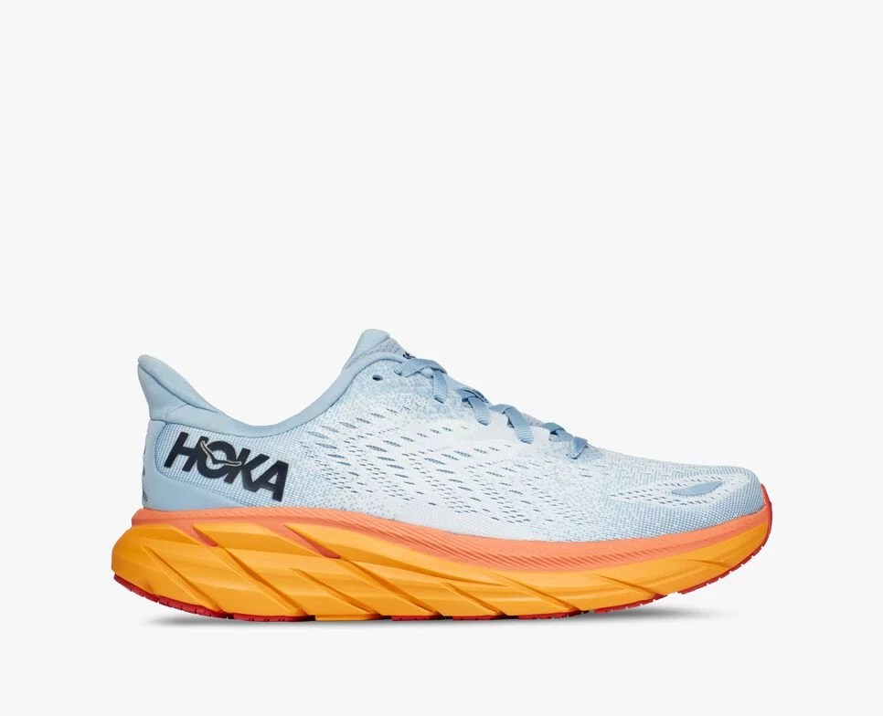 A blue Hoka running shoe with a tangerine sole as seen from the side.