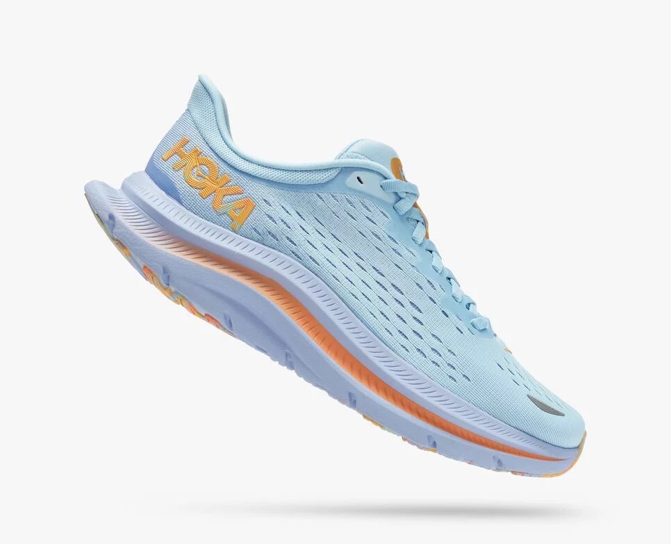 A side image of blue Hoka running shoes with a rainbow sherbert sole.