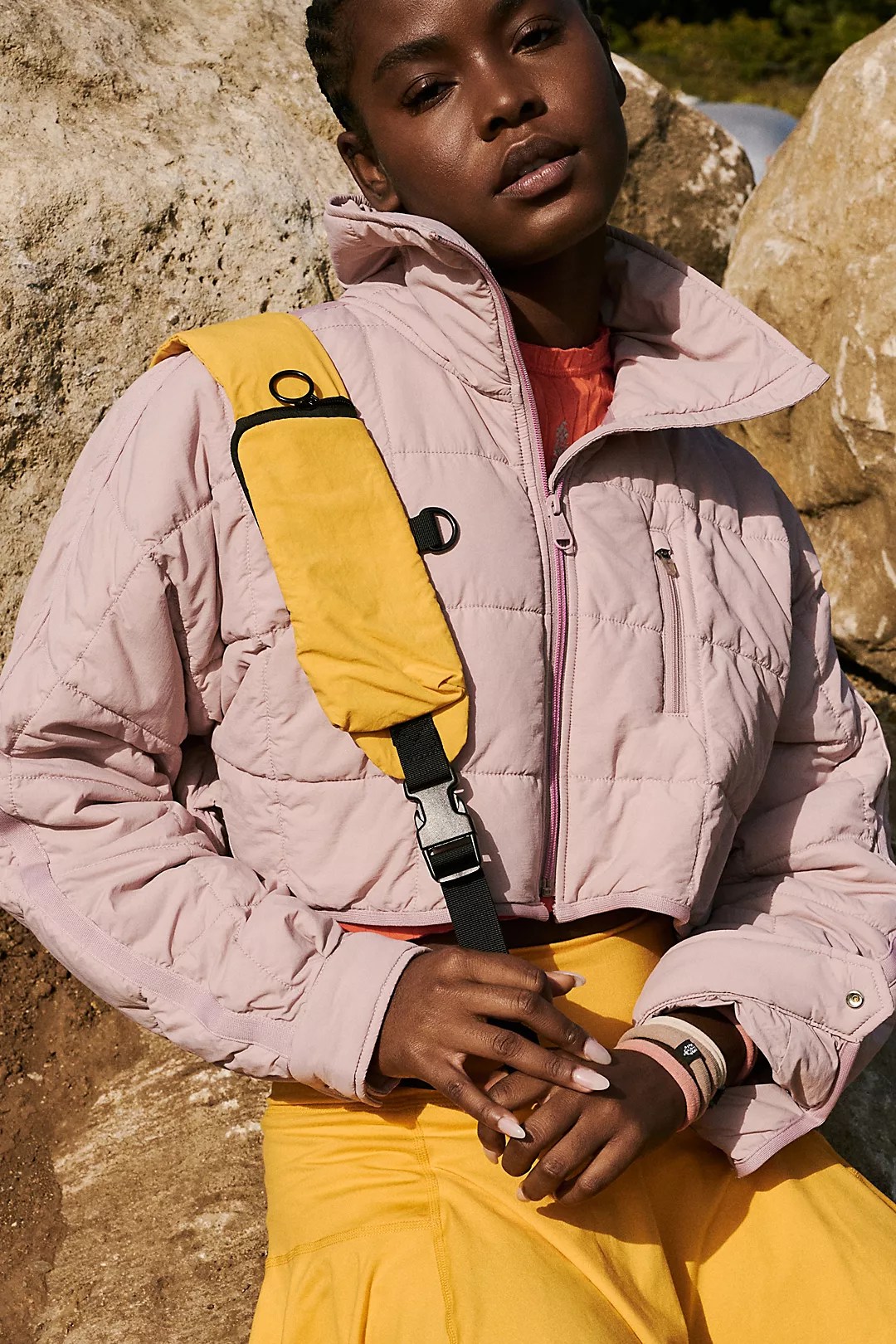pippa packable cropped puffer in a dusty pink color on a model