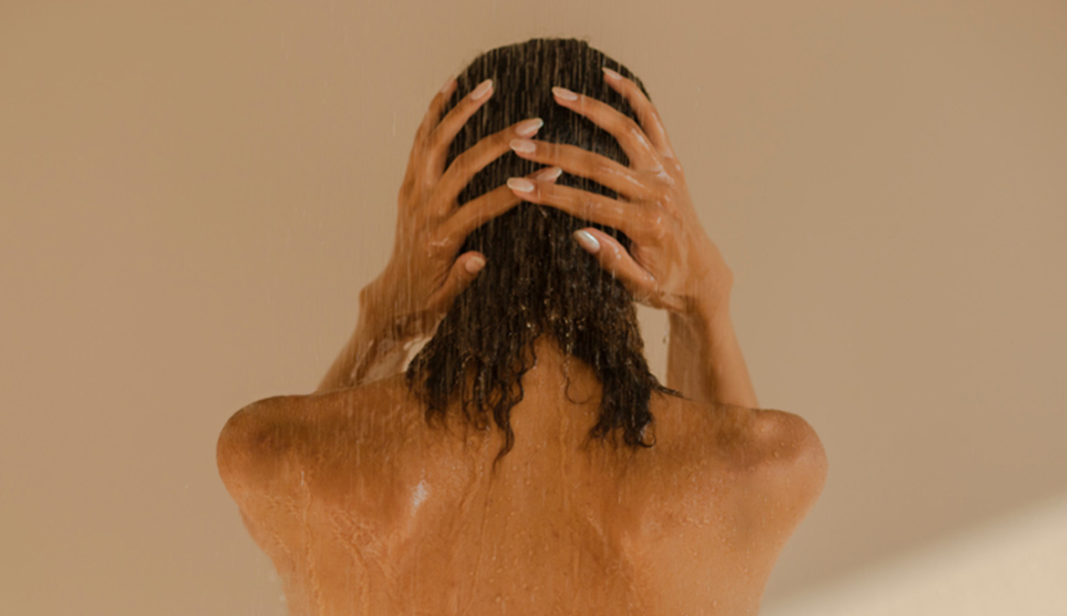 A woman washing her hair.