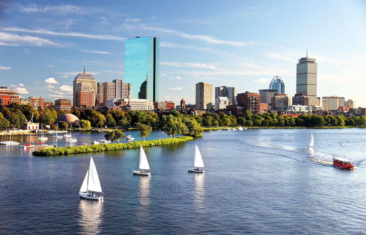 Landscape image of the Charles River and Boston skyline.