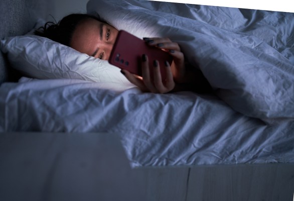 Scrolling on Your Phone in Bed Could Make Your Melatonin Supplements Less Effective, According to...