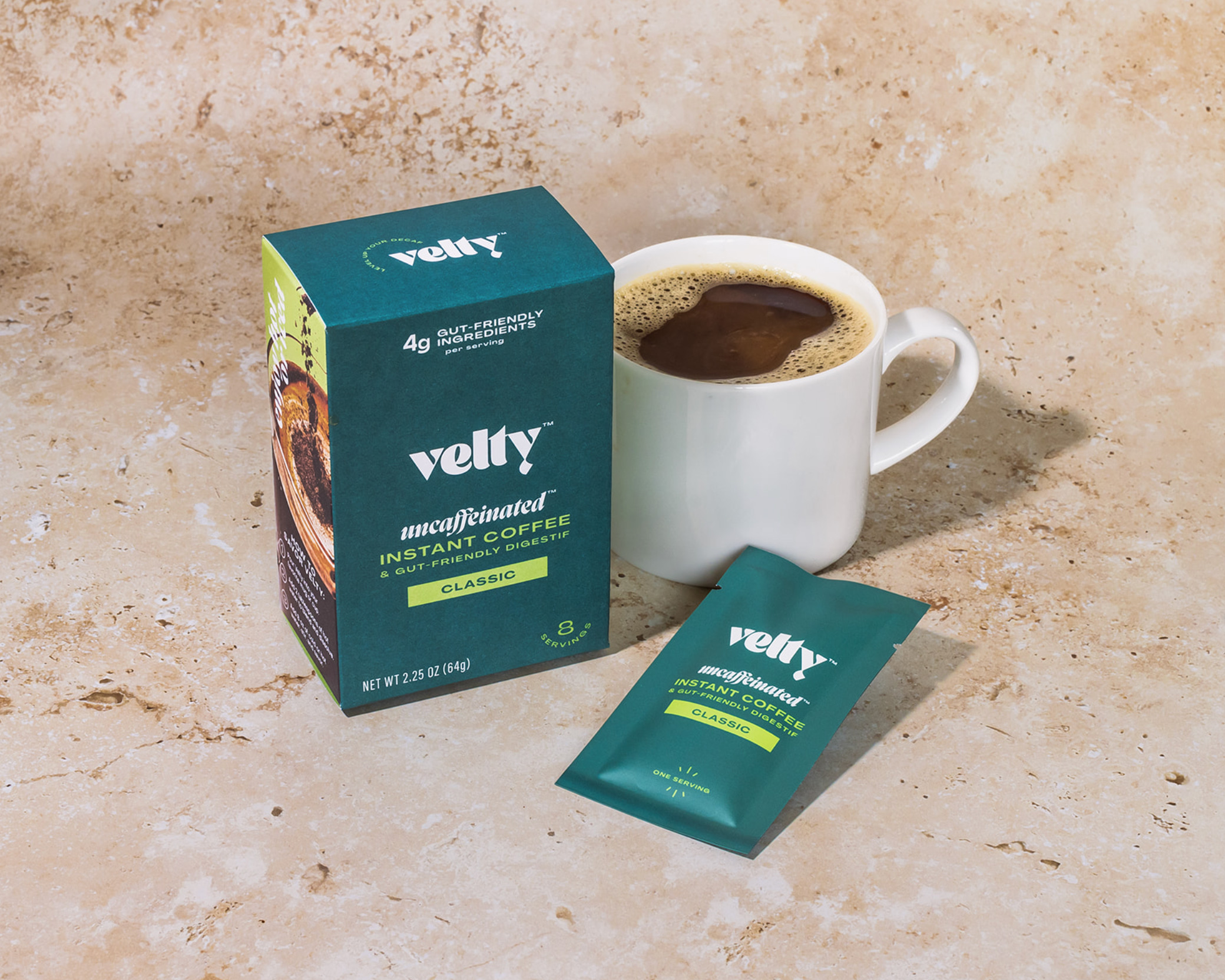 velty instant decaf coffee, one of the best instant coffees, next to a coffee mug