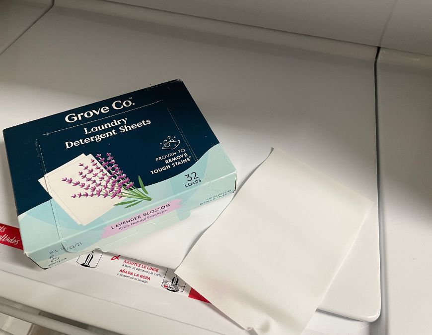 grove co. laundry detergent sheets on washing machine