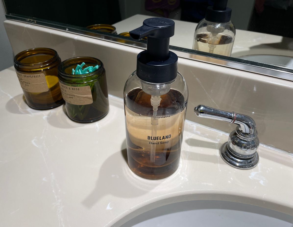 blueland foaming hand soap on bathroom counter, from the blueland and grove co review