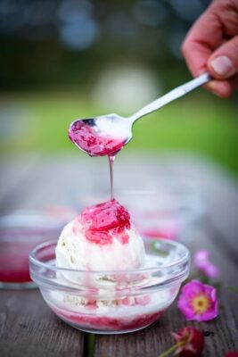A spoon of rose petal jam over ice cream