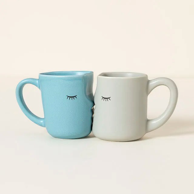 kissing mugs on a beige background, one of the best valentine's day gifts for couples