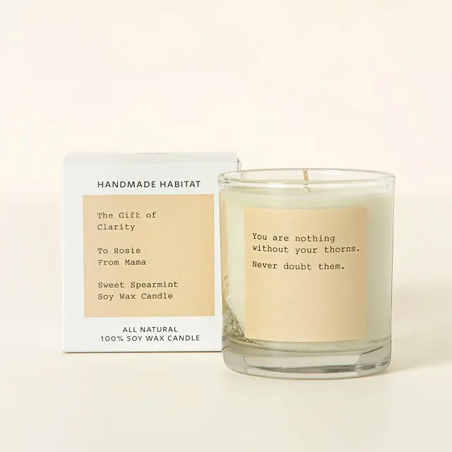 uncommon goods personalized candle, a cute valentine's day gift, on a beige background