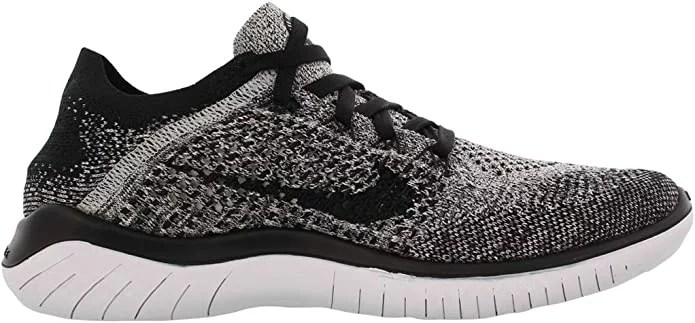 A grey and black pair of nike women's free rn flyknit rowing shoes