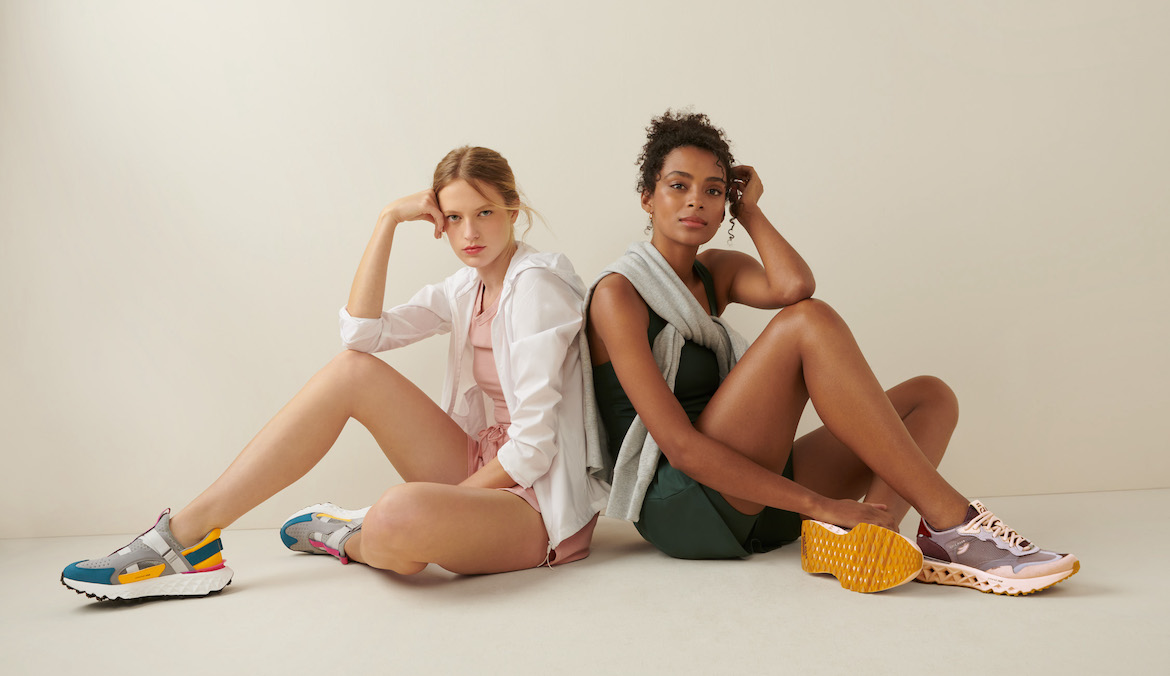 Two models wearing Cole Haan 5.Zerogrand Running Shoes