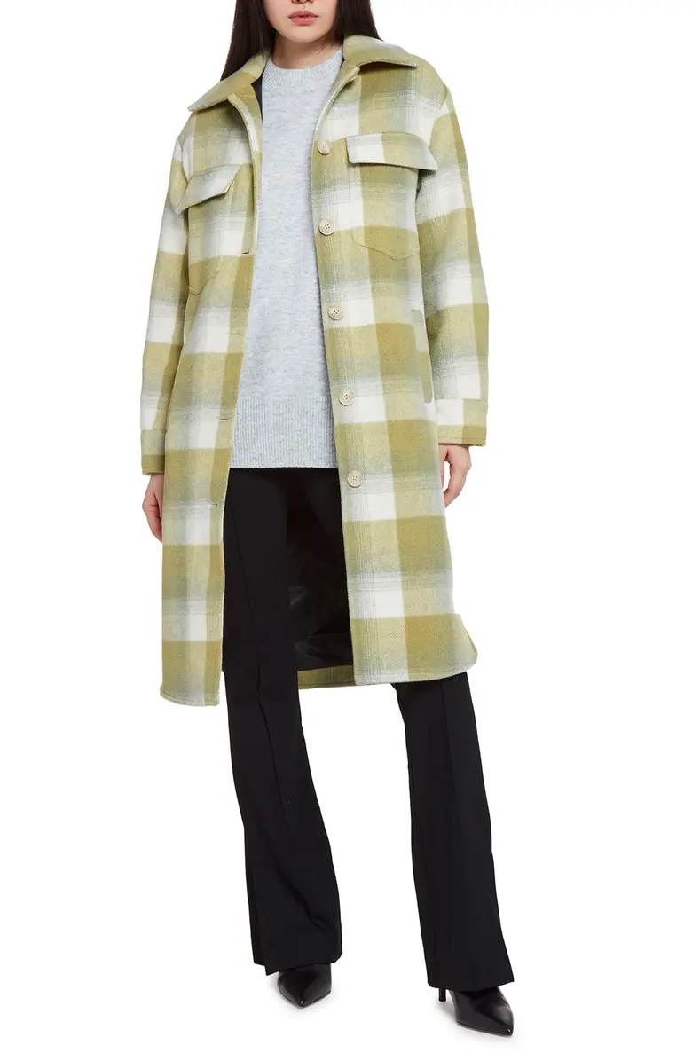 apparis plaid coat from nordstrom on a model wearing a grey shirt and black pants