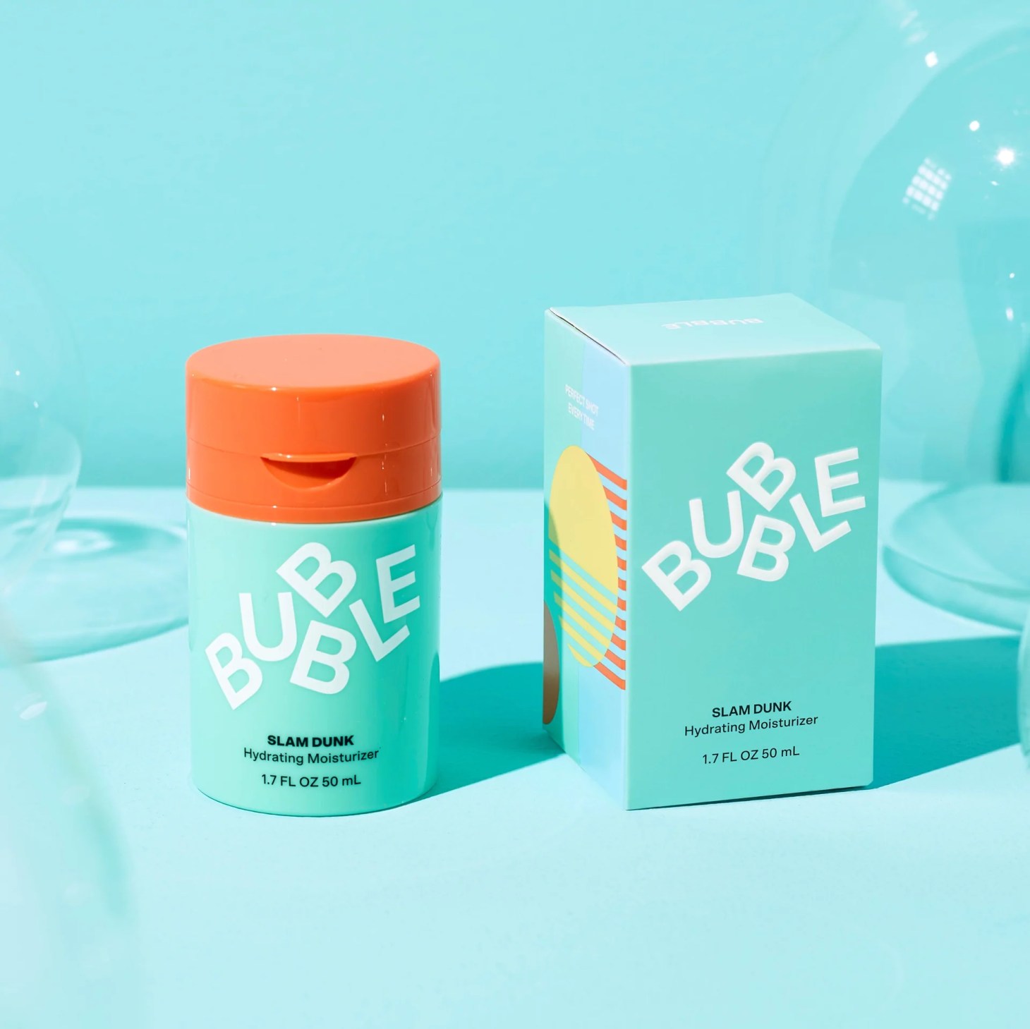 bubble slam dunk moisturizer and box on a blue background