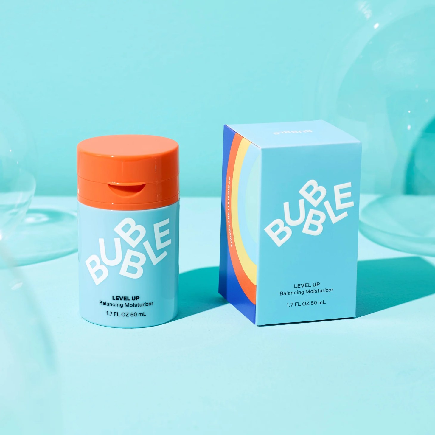 level up bubble moisturizer and box on a blue background