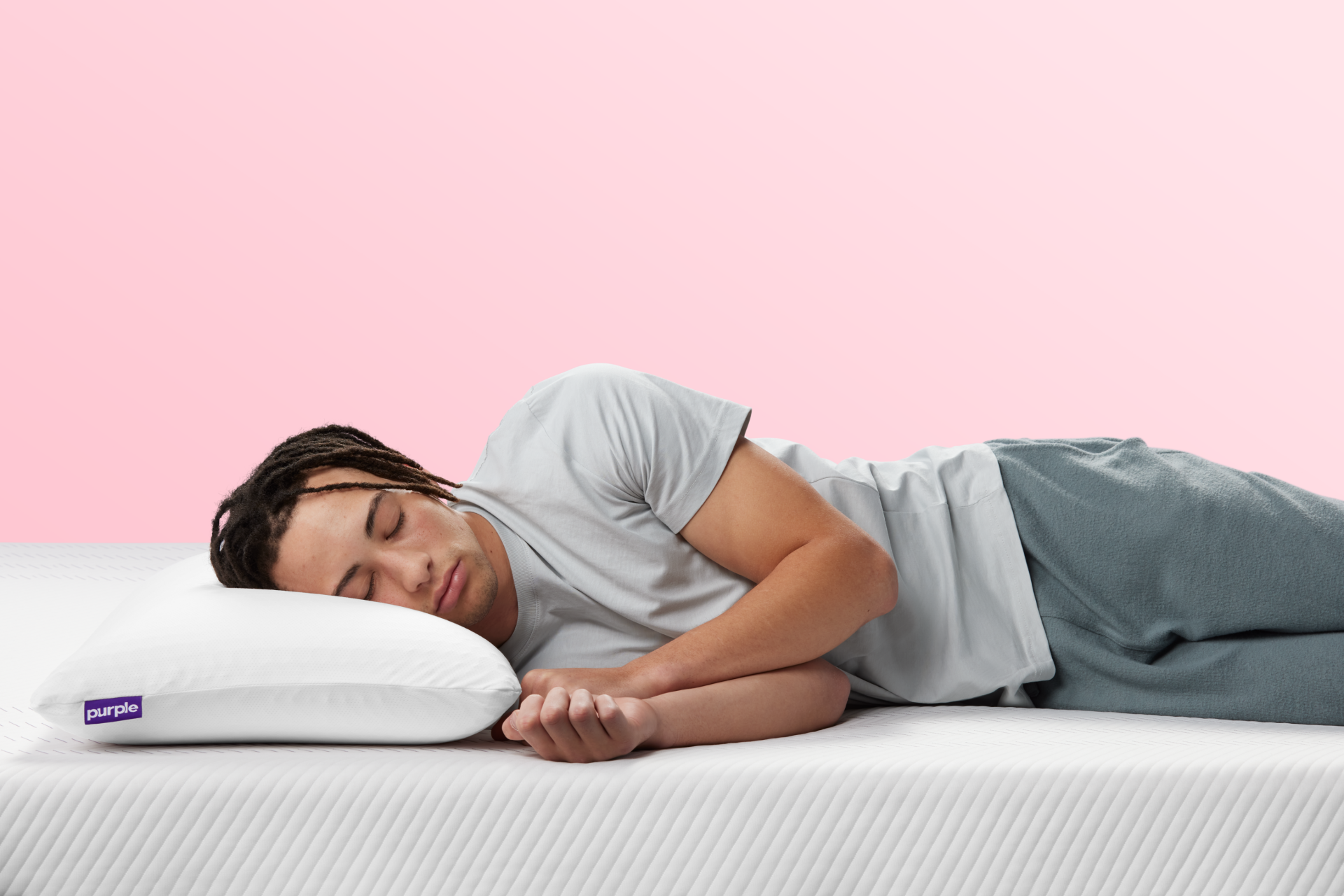 person sleeping on the purple harmony pillow