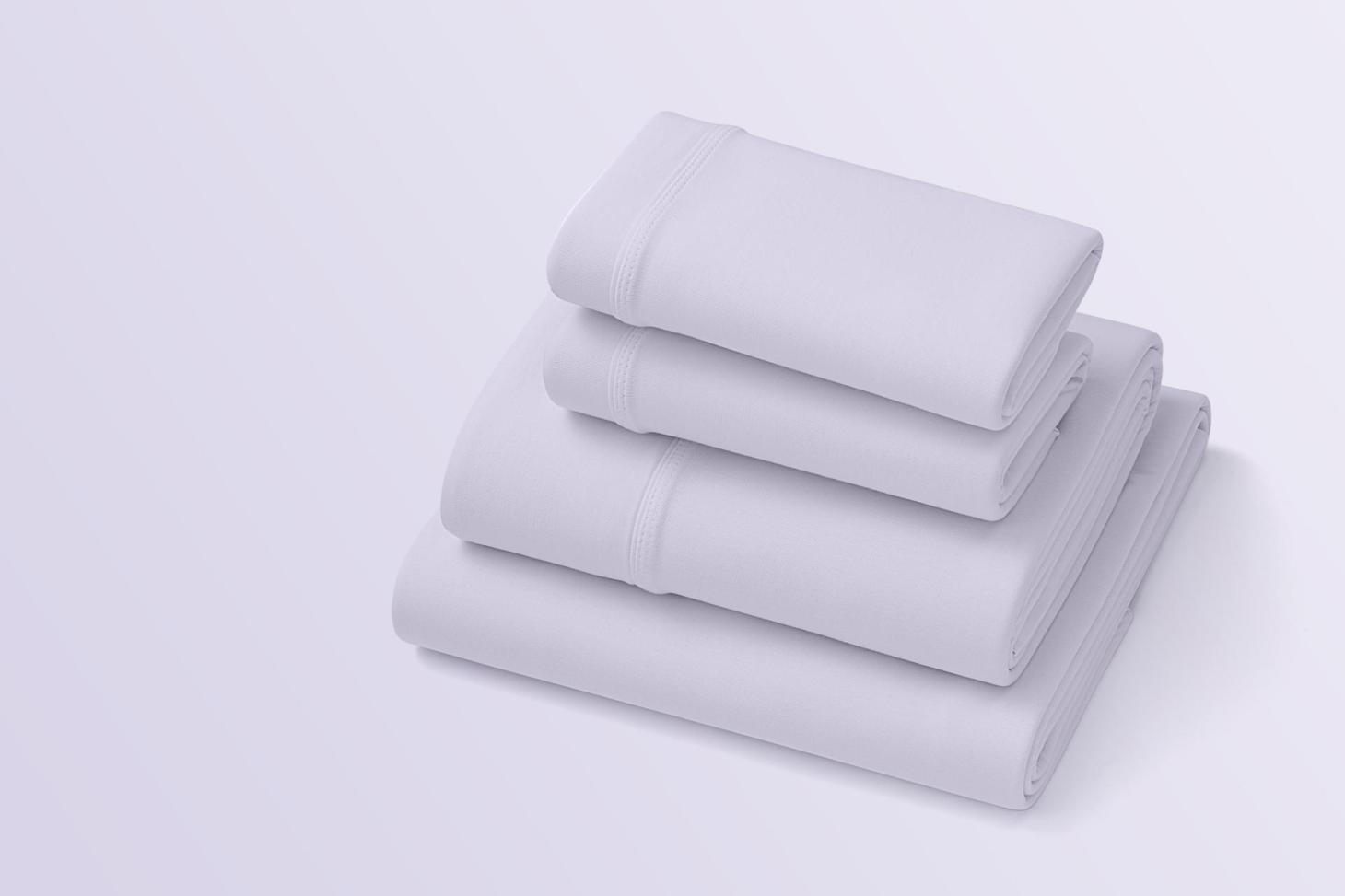 a stack of purple softstretch sheets, one of the best bed sheets for eczema