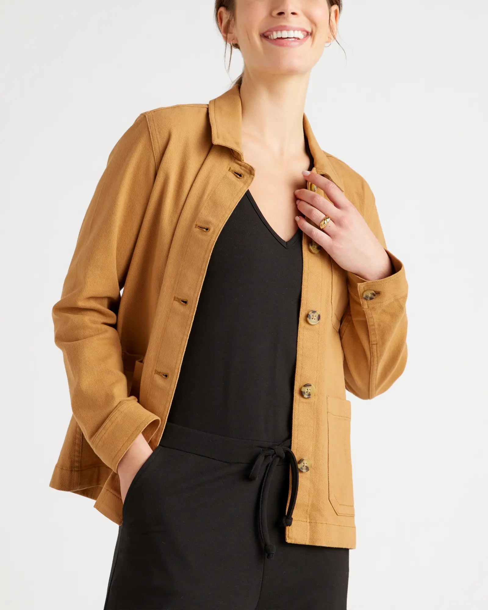 quince chore jacket on top of a black top. one of the best women's jackets for spring