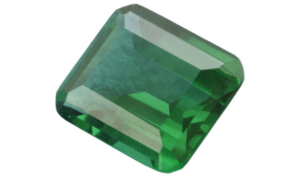A closeup of the May birthstone, a green emerald.