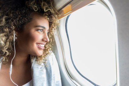 5 Rejuvenating Moves You Can Do in the Cramped Quarters of an Airplane Seat (Even in Economy)