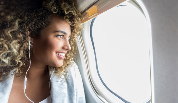 5 Rejuvenating Moves You Can Do in the Cramped Quarters of an Airplane Seat (Even...
