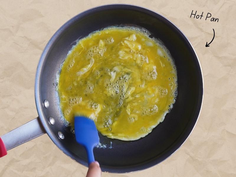 how to make the fluffiest scrambled eggs hot pan